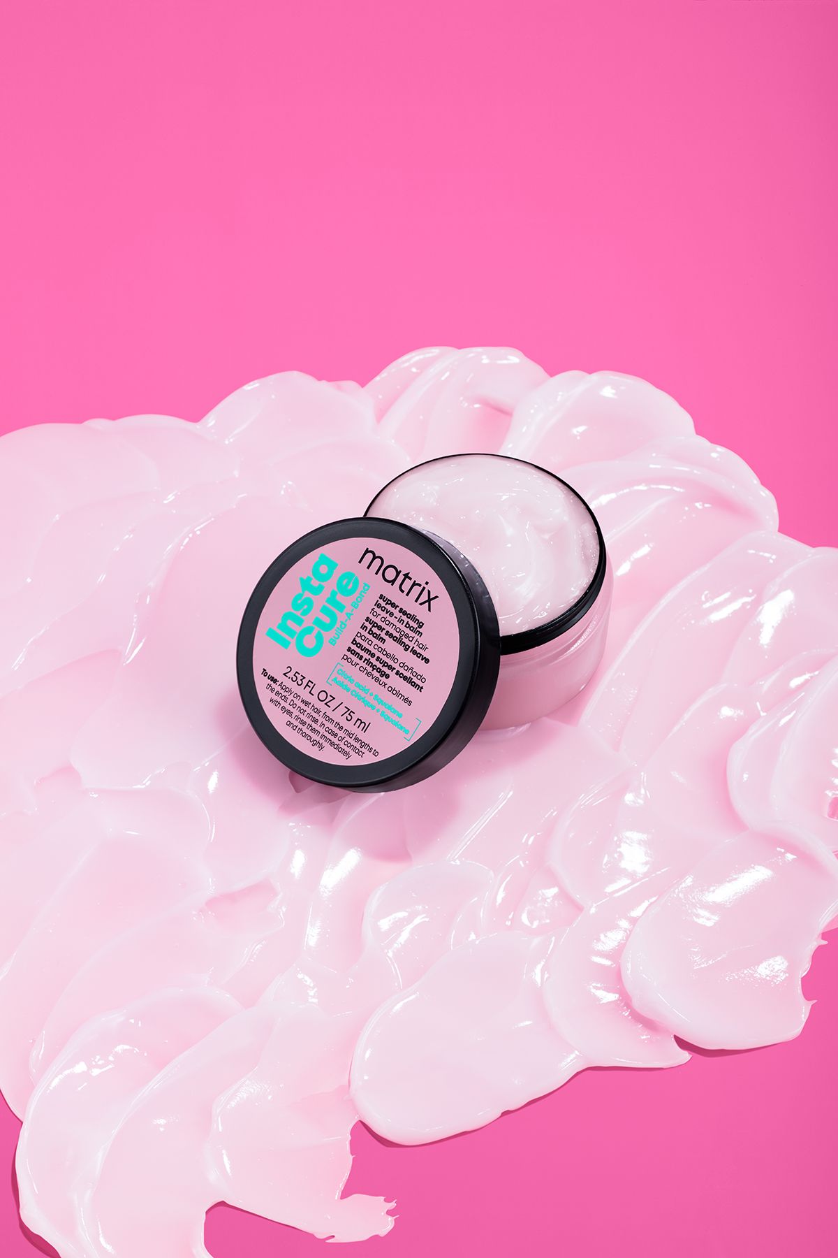 Matrix Insta-Cure mask resting in swirls of its own formula. The texture shot that sells a treatment before the copy does.
